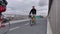 Cyclists drive over the bridge at summer cloudy day, Denmark Scandinavia