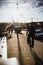 Cyclists on Margaret Bridge, Margit hid, above Danube river in Budapest, Hungary on sunset. The bridge connects Buda, Pest and