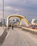 Cyclists and pedestrians on the New Cherry Street South Bridge in the Port lands at sunset