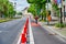 Cyclists in a protected bike lane on a main street to improve road safety