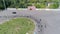 Cyclists race, lot bicyclist ride on square at competition past cars parking in view from above