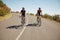 Cyclists riding down a country road