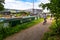 Cyclists riding the pathway along the River Lee London