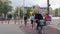 Cyclists riding in urban environment on cycle paths with segregated traffic in