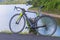 Cyclo cross bicycle with a helmet, standing at the road near res