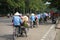 Cyclo pedicab driver wears conical hat on Hanoi street