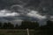 Cyclone over a rural house.