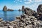 Cyclops island, basaltic rock fomation in Aci Trezza, Catania, Sicily, Italy.