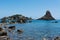 Cyclops islands, Acitrezza, Sicily. Basalt rocks on the sea