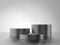 Cylinder metal podium isolated on gray background.