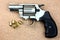 Cylinder revolver handgun over wooden background!