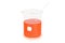 Cylindric Beaker (glassware) with orange reagent isolated on white background