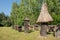 Cylindrical wooden beehive with thatched roof in the open-air Museum of Folk Culture, Bialystok, Podlaskie Voivodeship