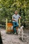 cynologist training with siberian husky dog on jumping