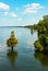 Cypress trees growing in high water on a lake with boat piers along the side