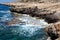 Cyprus island. Beautiful seascape. Azure sea, waves, rocky coast, bright sunny day.