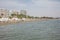 Cyprus, Larnaca. Multi-storey buildings, sandy beach, blue sea and sky