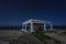 Cyprus Mediterranean seacoast at night, amazing landscape with church and blue sky with stars