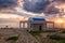 Cyprus Mediterranean seacoast at sunrise, amazing landscape with church, sky with colorful clouds and sun