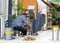 CYPRUS, NICOSIA - JUNE 10, 2019: Poor Elderly Greek couple of craftsmen making wicker chairs on a city street. Family business