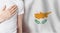 Cyprus person with hand on heart on the background of Cyprus flag. Patriotism, country, national, pride concept