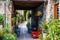 Cyprus village Lefkara. View of a village stony street with lots of green and flower pots. There several colorful chairs on the