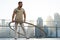 Cyr Wheel artist with cityscape background of Dubai during sunset