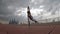 Cyr Wheel artist with cityscape background of Dubai during sunset