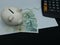 czech banknotes, piggy bank and calculator on background with rising trend green line