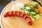 Czech cuisine. Sausage, cucumber, pepper and horseradish in a restaurant. Selective focus