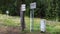 Czech - German border and tourist signpost in Sumava National Park. TRANSLATION: Attention! state border red in Czech, state