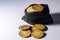 Czech gold coins in a black bag on a white background