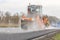 CZECH REPUBLIC, PLZEN, 7 MAY, 2016:Asphalt spreading machine and vibration roller at pavement road works.