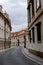 Czech Republic, Prague. Street between old tenements houses with red tiles.