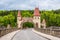 Czech republic, Talsperre Les Kralovstvi Forest Kingdom - May 15, 2021. Historic hydraulic water dam with orange water in river