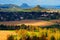 Czech typical autumn landscape. Hills and villages with sun. Morning fall valley of Bohemian Switzerland park. Hills with sun, lan