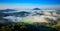 Czech typical summer landscape with fog. Hills and villages with foggy morning. Morning fall valley of Bohemian Switzerland park.