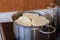 Czech yeast dumpling sliced into wheels and put into a steaming pot to keep the dumpling hot