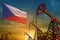 Czechia oil industry concept. Industrial illustration - Czechia flag and oil wells against the blue and yellow sunset sky