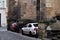 Czechia people driving and stop parking car in narrow niche beside of castle in Old Town Square at Praha city urban capital in