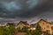 Czluchow, Pomeranian Voivodeship / Poland - June 15, 2019: Dark storm clouds over single-family houses during a storm.