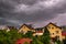 Czluchow, Pomeranian Voivodeship / Poland - June 15, 2019: Dark storm clouds over single-family houses during a storm.