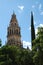 CÃ³rdoba Cathedral Minaret and Cypress Tree against Blue Sky.