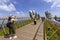 Da Nang, Vietnam - October 31, 2018: Tourists in Golden Bridge, a pedestrian footpath lifted by two giant hands, open in July 2018