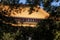 Dabei Temple in Xiamen, View from Tree Leaves with a Plaque Named `Dabei Temple` and the Ancient Eave