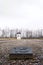 Dachau, Upper Bavaria / Germany - March 2018: A guard tower stands tall over rows of stone and rock.