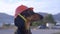 Dachshund wearing builder helmet and barking.