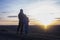 Dad and daughter. Against the background of the sunset and mountains. father\\\'s day Dad hugs the children. Family