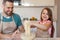 Dad And Daughter Baking Having Fun With Dough In Kitchen