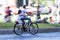 Dad and daughter biking (panning effect)